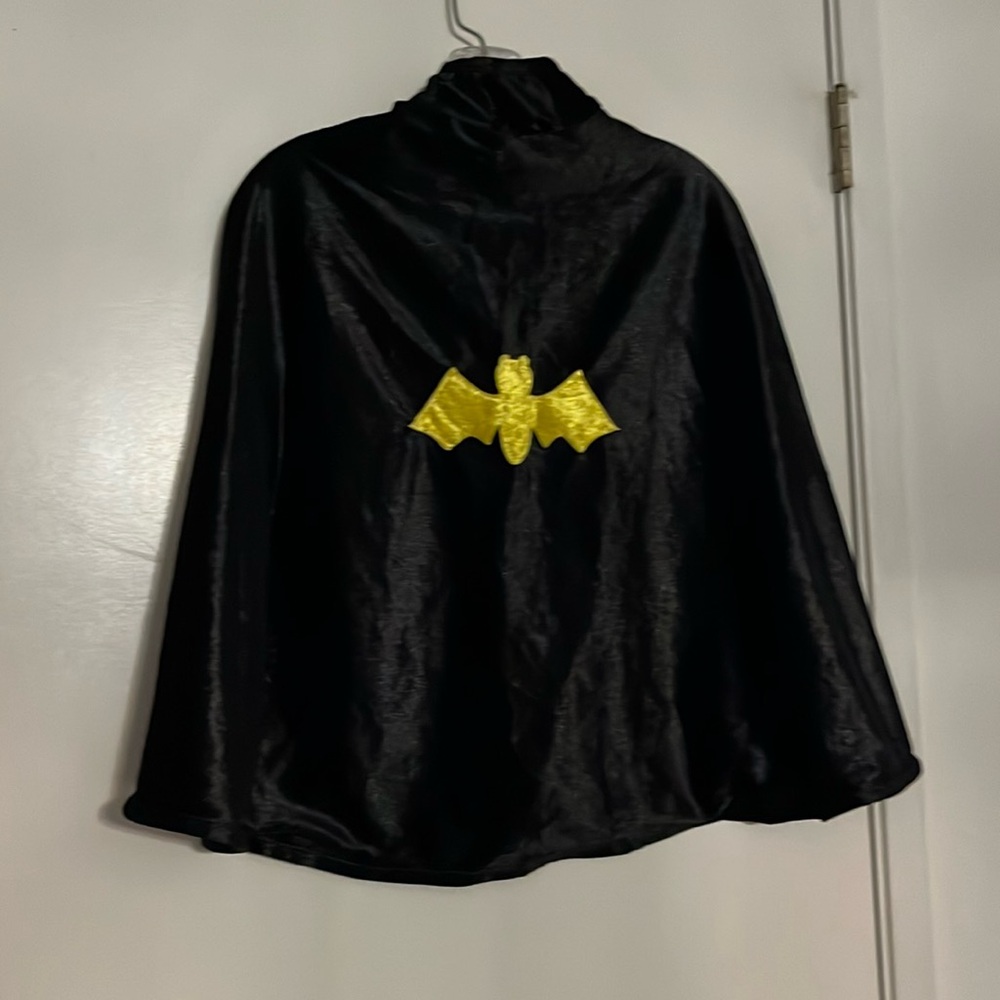 Kid costume cape reversible Batman and spiderweb design.  Fits small /medium EUC